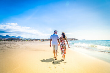 Wall Mural - Happy young couple at the sea vacations