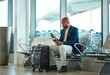 Travel, passport and phone with black man in airport for social media, business trip and and networking. Communication, vacation and email with passenger on layover for first class, app and ticket