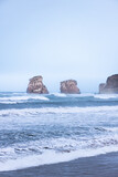 Fototapeta Uliczki - Two famous twin rocks (Dunbarriak) next to Hendaia beach at the Basque Country's coast.