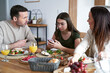 © gpointstudio - Caucasian family eating lunch and teenager girl using mobile phone