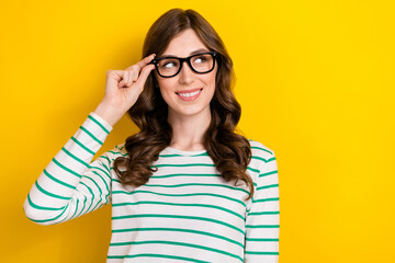 Poster - Photo of smart intelligent person young attractive girl touch eyewear optician glasses vision looking empty space isolated on yellow color background