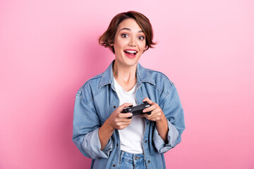 Sticker - Photo of sweet excited lady dressed denim jacket enjoying playstation game isolated pink color background