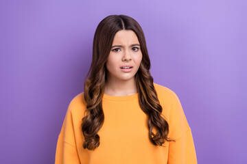 Wall Mural - Photo of nervous lady girl wear orange trendy clothes suspicious look camera disagree social opinion isolated on purple color background