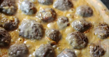 Wall Mural - Swedish meatballs are prepared in sauce, close-up