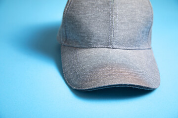 Wall Mural - Baseball cap on the blue background.