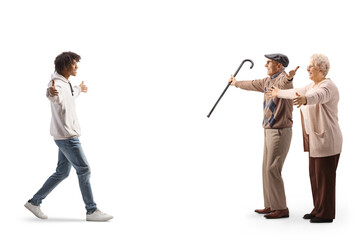 Canvas Print - African american young man walking towards caucasian elderly man and woman