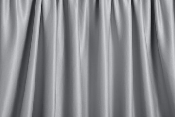 A backdrop of a pleated ultimat grey curtain