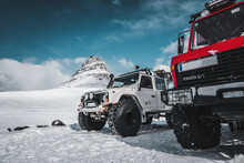 Two Large Four-wheel-drive Vehicles Covered In Snow And Ice In Iceland