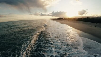 Wall Mural - Ocean water with winter clouds in evening sky aerial 