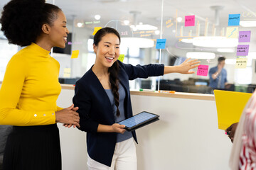 Diverse businesswomen talking and brainstorming in office