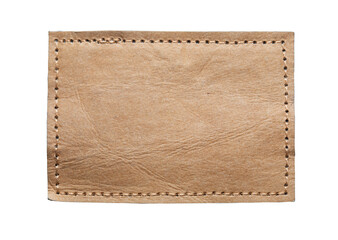 blank brown leather label on white background, macro close up. synthetic leather patch with stitchin