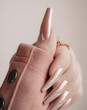 Beautiful pink nail manicure. Stylish pastel pink manicure. Nail polish. Art pink manicure.