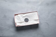 Gift box mockup on gray concrete background, top view. View from above minimalist tissue wrapping gift