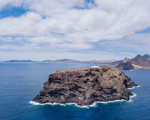 Aerial Front View Of Ilhéu De Cima At Porto Santo Island. This Islet Has A Lighthouse That Can Be Visited. Copy Space.