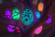 Glowing luminescent easter eggs hanging on a tree in the garden. Generative AI