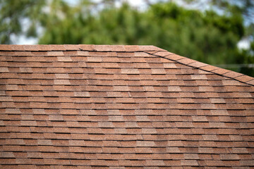 Wall Mural - Closeup of house roof top covered with asphalt or bitumen shingles. Waterproofing of new building