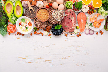 Wall Mural - Ketogenic low carbs diet concept. Ingredients for healthy foods selection set up on white wooden background.