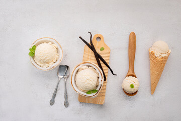 Fototapete - Coconut ice cream flavours in half of coconut setup on white stone background. Summer and Sweet menu concept.