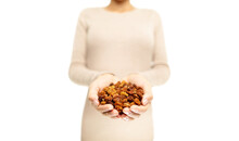Golden Berries. Superfoods - Woman Showing Dried Inca Berry, Also Called Ground Cherries. Heap Of Organic Healthy Golden Berry Super Food. Isolated Cutout PNG On Transparent Background