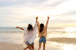 © CandyRetriever  - Group of Young Asian woman friends in walking and playing sea water together on tropical island beach at summer sunset. Attractive girl enjoy and fun outdoor lifestyle travel on beach holiday vacation