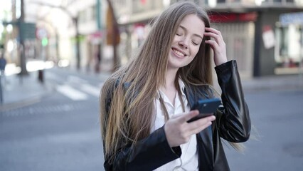 Sticker - Young blonde woman smiling confident using smartphone at street