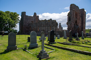 Wall Mural - Graveyard/churchyard at Lindisfarne Priory on Holy Island, Northumberland, UK