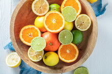 Tasty And Fresh Mix Of Citrus Fruits In Wooden Bowl.