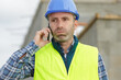 © auremar - portrait of male worker on the phone outdoors