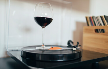 Glass of wine swirling on the turntable 