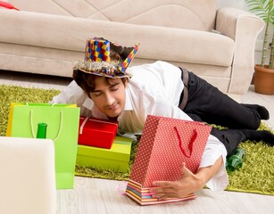 Wall Mural - Young man having hangover after party