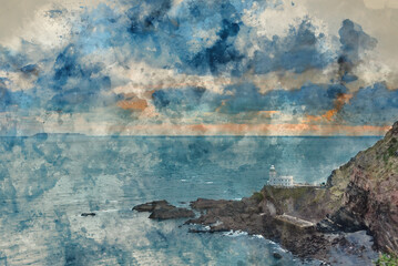 Wall Mural - Lovely sunrise landscape image of Devon coastline in England with stunning golden hour light on the land and sky