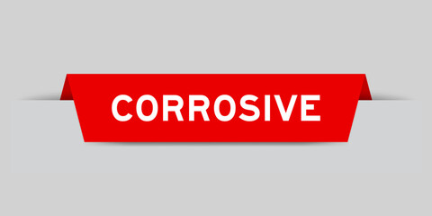 Sticker - Red color inserted label with word corrosive on gray background