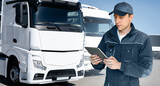 Fototapeta Mapy - Manager with a digital tablet next to trucks. Fleet management	