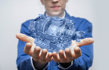 Poster - Development engineer holds in his hands a model of an electric motor created in augmented reality.
