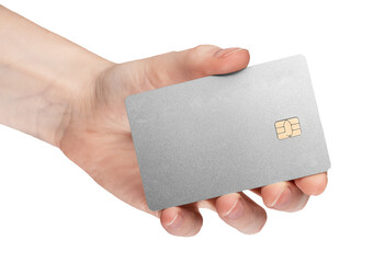 silver bank card with chip in female hand isolated on white background
