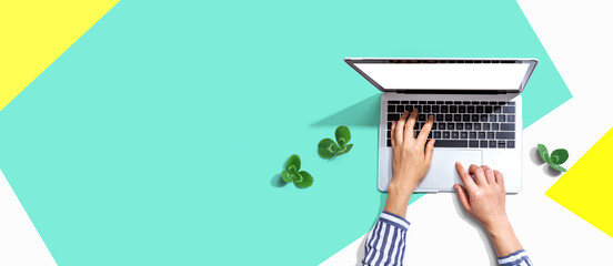 Wall Mural - Laptop computer with shamrock leaves - flat lay
