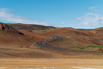 Hverir geothermal area in Iceland. Popular tourist area with mud pots and smoking vents.