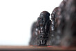 Chinese oriental chess pieces, with a row of figures representing pawns. Antique chess set and board