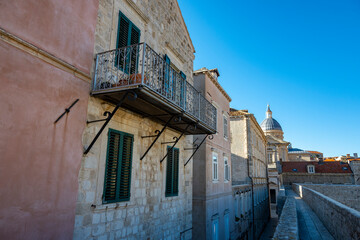 Wall Mural - Beautiful Dubrovnik city streets with old houses and vintage balconies suspended above the stone paved streets