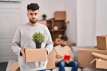 Canvas Print - Homosexual couple moving to a new home depressed and worry for distress, crying angry and afraid. sad expression.