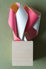 Sticker - wood box and curled and turnover paper objects with strong 3d qualities