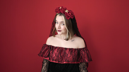 Wall Mural - Young blonde woman wearing katrina costume smiling confident over isolated red background