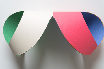 Canvas Print - abstract 3d paper object composed of green, white, red, and blue construction paper