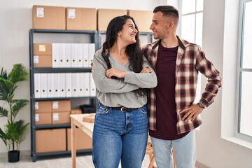 Wall Mural - Man and woman ecommerce bussines workers standing together at office