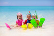 © famveldman - Kids snorkel. Children snorkeling in tropical sea.