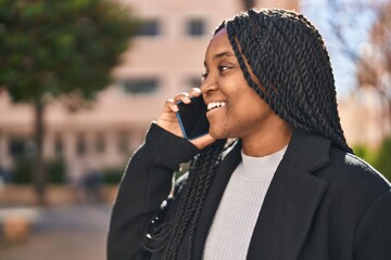 Poster - African american woman smiling confident talking on the smartphone at park