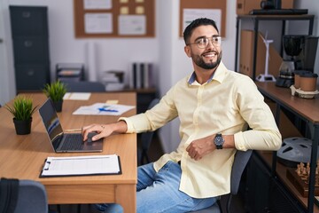 Wall Mural - Young arab man business worker using laptop working at office