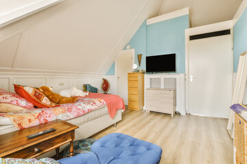 a bedroom with blue walls and white trim on the ceiling, there is a bed that has been used for storage
