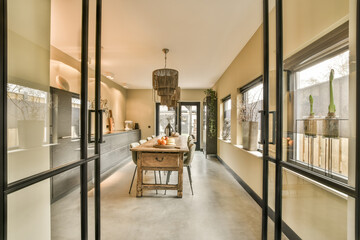 Wall Mural - a kitchen and dining area with glass doors that open to the patio, which has been used for outdoor entertaining