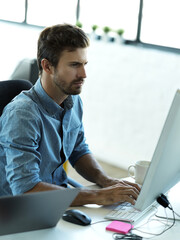 Aufkleber - Serious man, computer typing and web business planning a website layout in office. Content management, startup and employee on technology working on creative strategy design with tech software